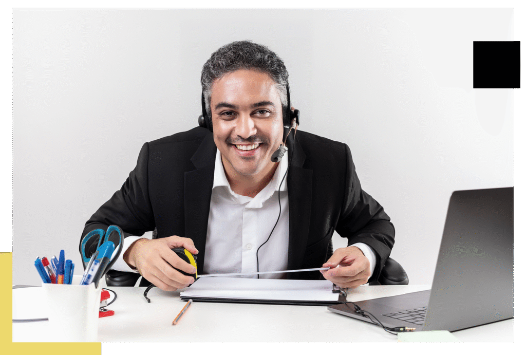 CyberCityMX representative assisting a customer, wearing a headset and working at a modern call center workstation.