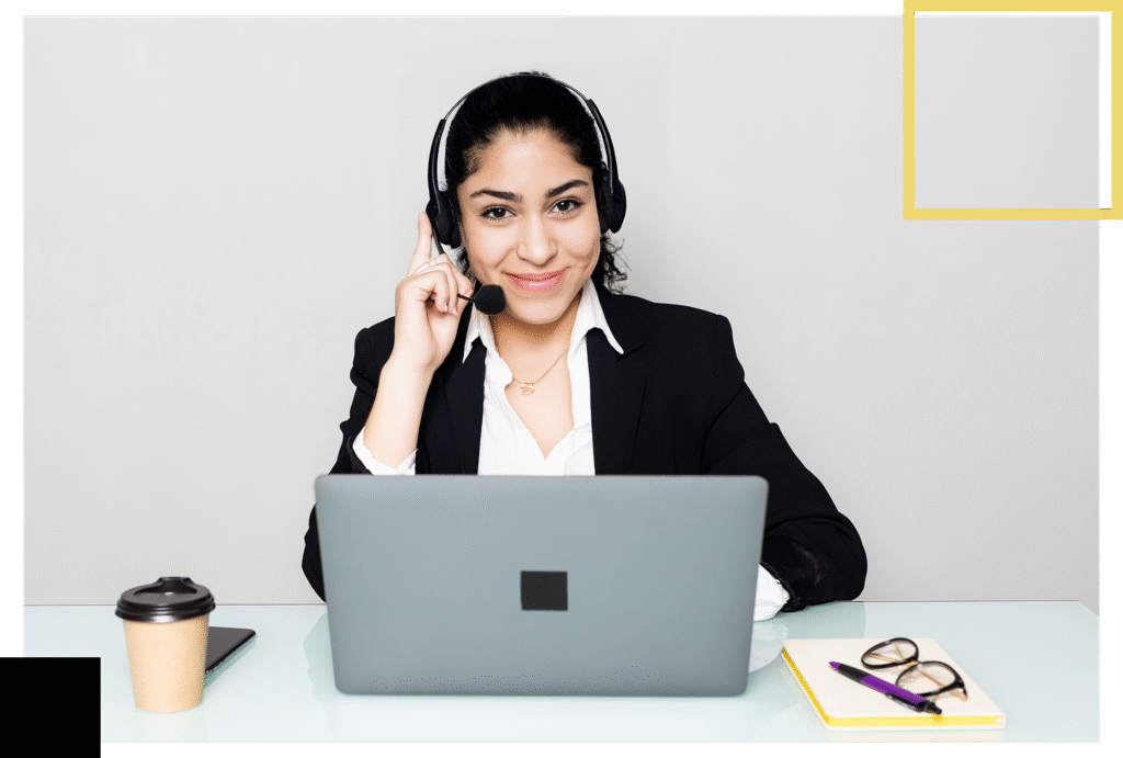 CyberCityMX call center agent smiling while working at a headset, representing professional customer support.